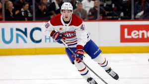 Montreal Canadiens' Lane Hutson (48) controls the puck against the Carolina Hurricanes during overtime period in Game 2 of the Eastern Conference finals NHL hockey Stanley Cup playoff series in Raleigh, N.C., Tuesday, May 26, 2026. (Karl DeBlaker/AP)