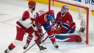 Montreal Canadiens goaltender Jakub Dobes (75) reacts as he is scored on by Carolina Hurricanes' Jordan Staal (11) as Canadiens' Josh Anderson (17) defends during first period of Game 4 of the NHL Eastern Conference final Stanley Cup playoff series action in Montreal on Wednesday, May 27, 2026. (Christinne Muschi/CP)