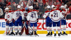 Montreal Canadiens players join goaltender Jakub Dobes, fourth from left, following Game 5 of the Eastern Conference finals NHL hockey Stanley Cup playoff series against the Carolina Hurricanes in Raleigh, N.C., Friday, May 29, 2026. (Karl DeBlaker/AP)