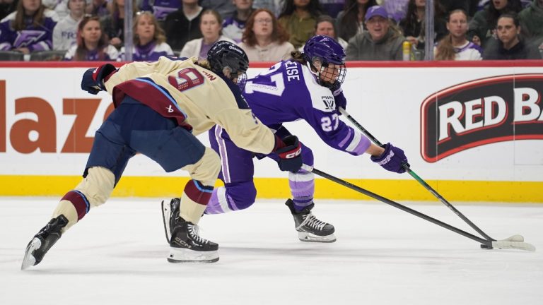 Montreal Victoire defenseman Kati Tabin (9) and Minnesota Frost forward Taylor Heise (27) reach for the puck during the first period of game 3 of a PWHL hockey semifinals game, Thursday, May 7, 2026, in St. Paul, Minn. (Abbie Parr/AP)