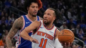 New York Knicks' Jalen Brunson, right, drives past Philadelphia 76ers' Kelly Oubre Jr. during the first half of Game 1 in a second-round NBA basketball playoffs series Monday, May 4, 2026, in New York. (Seth Wenig/AP)