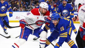 Montreal Canadiens centre Nick Suzuki, front left, and Buffalo Sabres centre Peyton Krebs battle after a face-off during the second period in Game 1 of a second-round Stanley Cup playoff series, Wednesday, May 6, 2026, in Buffalo, N.Y. (AP/Jeffrey T. Barnes)