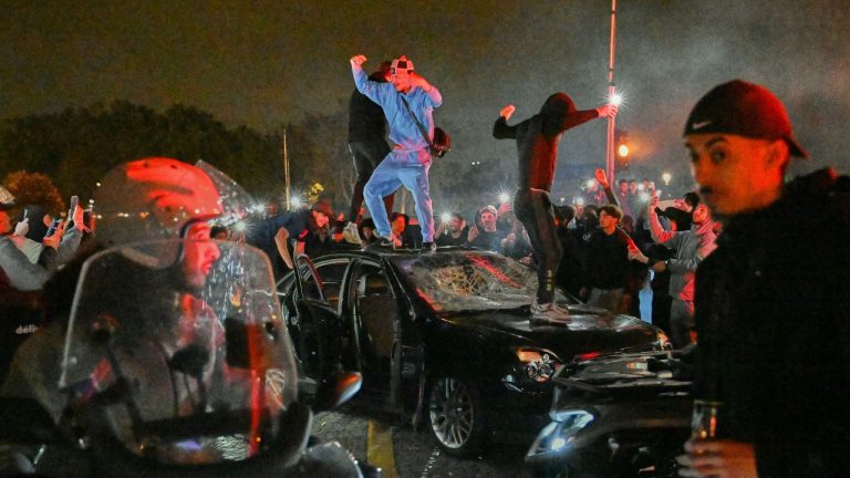 People smash a car as they celebrate Paris Saint-Germain's Champions League semifinal victory over Bayern Munich at Place de la Concorde in Paris, Thursday, May 7, 2026. (Emma Da Silva/AP)