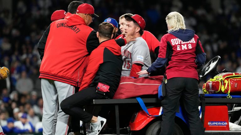 Cincinnati Reds manager Terry Francona, left, talks to relief pitcher Emilio Pagan, as he leaves the field after an injury during the ninth inning of a baseball game against the Chicago Cubs in Chicago, Tuesday, May 5, 2026. (Nam Y. Huh/AP)