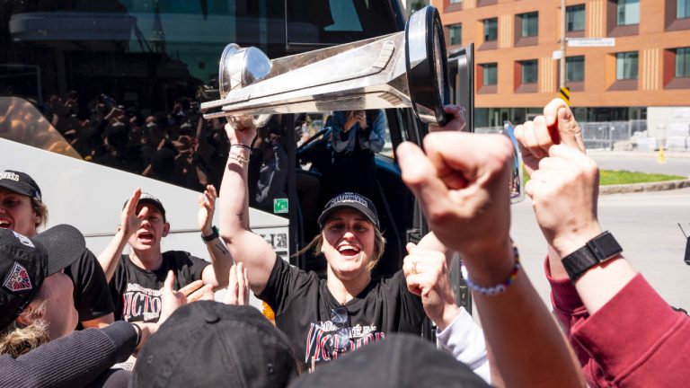 Montreal Victoire's Marie-Philip Poulin hoists the Walter Cup after arriving in Montreal following winning the franchise's first championship, on Thursday, May 21, 2026. (Christopher Katsarov/CP)