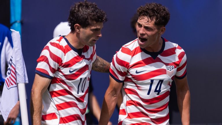 United States forward Christian Pulisic (10) celebrates with midfielder Sebastian Berhalter (14) after scoring in the first half against Senegal in an international friendly soccer match Sunday, May 31, 2026, in Charlotte, N.C. (AP Photo/Scott Kinser)