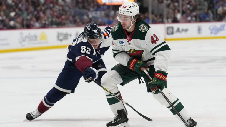 Minnesota Wild defenceman Quinn Hughes, right, drives past Colorado Avalanche left wing Artturi Lehkonen in the second period of an NHL hockey game Thursday, Feb. 26, 2026, in Denver. (David Zalubowski/AP)