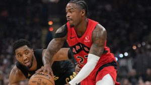 Toronto Raptors guard Jamal Shead (23) drives past Cleveland Cavaliers guard Donovan Mitchell, left, in the first half in Game 7 of a first-round NBA basketball playoffs series in Cleveland, Sunday, May 3, 2026. (AP Photo/Sue Ogrocki)