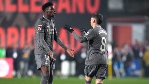 Real Madrid's Federico Valverde, right, celebrates with Real Madrid's Aurelien Tchouameni after scoring his side's opening goal during the Spanish La Liga soccer match between Rayo Vallecano and Real Madrid at the Vallecas stadium in Madrid, Spain, Saturday, Dec. 14, 2024. (AP Photo/Manu Fernandez)