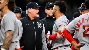 Detroit Tigers manager A.J. Hinch, left, talks with Boston Red Sox's Willson Contreras after Trevor Story was hit by a pitch during the fourth inning of a baseball game, Tuesday, May 5, 2026, in Detroit. (Jose Juarez/AP)