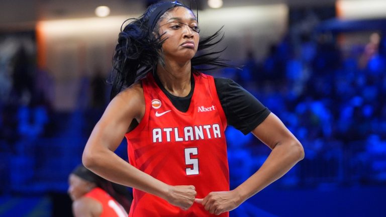 Atlanta Dream forward Angel Reese reacts after scoring during the first half of a WNBA basketball game against the Dallas Wings in Arlington, Texas, Tuesday, May 12, 2026. (AP Photo/LM Otero)