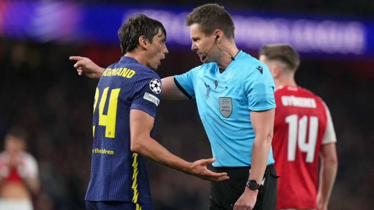 Atletico Madrid's Robin Le Normand speaks to Referee Daniel Siebert during a Champions League semifinal, second leg, match between Arsenal FC and Atletico Madrid in London, Tuesday, May 5, 2026. (Alastair Grant/AP)