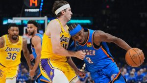 Oklahoma City Thunder guard Shai Gilgeous-Alexander (2) drives to the basket as Los Angeles Lakers' Austin Reaves, left, defends in the second half of Game 1 in a second-round NBA basketball playoffs series Tuesday, May 5, 2026 in Oklahoma City. (Kyle Phillips/AP)