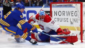 Buffalo Sabres right wing Josh Doan, left, is stopped by MontrÃ©al Canadiens goaltender Jakub Dobes (75) during the first period in Game 1 of a second-round NHL hockey Stanley Cup playoff series, Wednesday, May 6, 2026, in Buffalo, N.Y. (Jeffrey T. Barnes/AP)