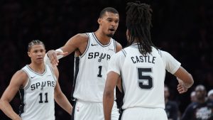 San Antonio Spurs forward Victor Wembanyama (1) celebrates a score with guard Stephon Castle (5) during the first half of Game 6 of an NBA basketball second-round playoffs series in Minneapolis, Friday, May 15, 2026. (Abbie Parr/AP)