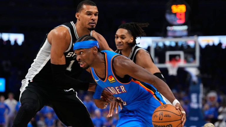 San Antonio Spurs forward Victor Wembanyama (1) defends against Oklahoma City Thunder guard Shai Gilgeous-Alexander (2) during the second half of Game 1 in a third-round NBA basketball playoffs series Monday, May 18, 2026, in Oklahoma City. (Tony Gutierrez/AP)