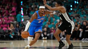 Oklahoma City Thunder guard Shai Gilgeous-Alexander (2) works toward the basket as San Antonio Spurs guard De'aaron Fox (4) defends during the second half of Game 3 in the Western Conference finals NBA basketball playoffs series Friday, May 22, 2026, in San Antonio. (AP Photo/Ashley Landis)