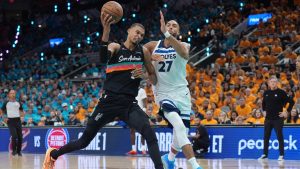 San Antonio Spurs forward-center Victor Wembanyama (1) works toward the basket as Minnesota Timberwolves center Rudy Gobert (27) defends during the first half in Game 1 of a second-round NBA playoffs basketball series in San Antonio, Monday, May 4, 2026. (AP Photo/Eric Gay)