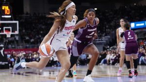 Washington Mystics' Shakira Austin (0) drives past Toronto Tempo's Nyara Sabally (8) during first half WNBA basketball action in Toronto on Friday, May 8, 2026. (Nathan Denette/CP)