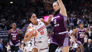 Washington Mystics' Cassandre Prosper (18) drives at Toronto Tempo's Marina Mabrey (3) during first half WNBA basketball action in Toronto on Friday, May 8, 2026. (Nathan Denette/CP)