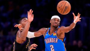 Oklahoma City Thunder guard Shai Gilgeous-Alexander, right, takes a pass while under pressure from Los Angeles Lakers forward Rui Hachimura during the first half of Game 4 in a second-round NBA basketball playoffs series Monday, May 11, 2026, in Los Angeles. (Mark J. Terrill/AP)