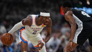 Oklahoma City Thunder guard Cason Wallace (22) drives against San Antonio Spurs guard Devin Vassell (24) in the first half of Game 5 in the Western Conference finals NBA basketball playoffs series, Tuesday, May 26, 2026, in Oklahoma City. (Julio Cortez/AP)
