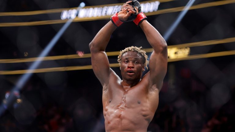 Ateba Gautier raises his hands after three rounds in a middleweight UFC bout in Las Vegas. (Steve Marcus/AP)