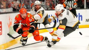 Anaheim Ducks centre Mikael Granlund, left passes the puck while under pressure from Vegas Golden Knights defenceman Rasmus Andersson during the first period in Game 3 of a second-round Stanley Cup playoff series Friday, May 8, 2026, in Anaheim, Calif. (Mark J. Terrill/AP)