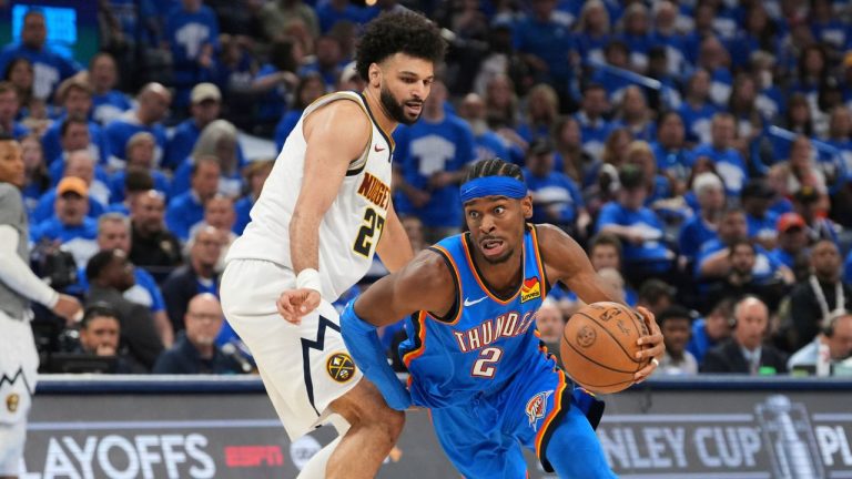 Oklahoma City Thunder guard Shai Gilgeous-Alexander (2) works to the basket against Denver Nuggets guard Jamal Murray, left, in the second half of Game 7 in the Western Conference semifinals of the NBA basketball playoffs, Sunday, May 18, 2025, in Oklahoma City. (AP Photo/Kyle Phillips)