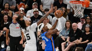 Oklahoma City Thunder guard Shai Gilgeous-Alexander (2) goes up for a basket in front of San Antonio Spurs guard Stephon Castle (5) during the first half of Game 4 in the Western Conference finals NBA basketball playoffs series in San Antonio, Sunday, May 24, 2026. (AP Photo/Darren Abate)