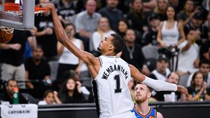 San Antonio Spurs forward Victor Wembanyama (1) scores a basket on the Oklahoma City Thunder during the second half of Game 4 in the Western Conference finals NBA basketball playoffs series in San Antonio, Sunday, May 24, 2026. (AP Photo/Darren Abate)