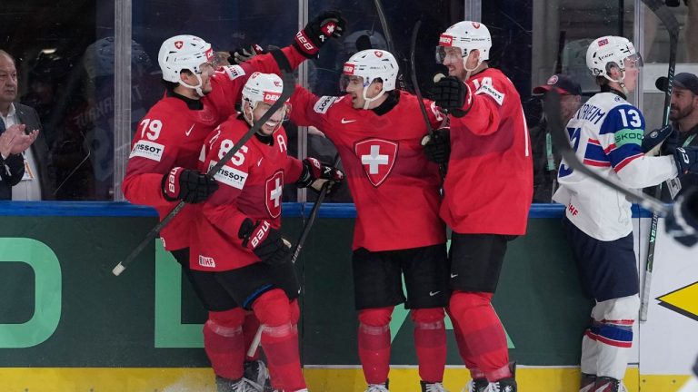 Switzerland's Ken Jager (62) celebrates after scoring his side's second goal during the 2026 IIHF Men's Ice Hockey World Championship semifinal match between Switzerland and Norway, in Zurich, Switzerland, Saturday, May 30, 2026, (AP Photo/Darko Bandic)