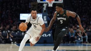 San Antonio Spurs guard Stephon Castle, left, drives against Minnesota Timberwolves guard Anthony Edwards, right, during the second half of Game 3 of a NBA second-round playoff series in Minneapolis, Friday, May 8, 2026. (Abbie Parr/AP)