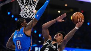 San Antonio Spurs guard Dylan Harper shoots against Oklahoma City Thunder guard Jalen Williams during the first half of Game 1 in a third-round NBA playoffs series Monday, May 18, 2026, in Oklahoma City. (Tony Gutierrez/AP)