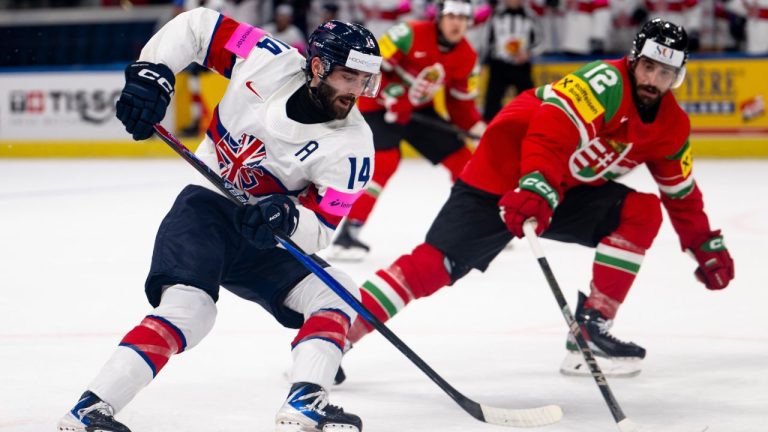 Great Britain's Liam Kirk, left, and Bence Stipsicz in action during the Men's Ice Hockey World Championship preliminary round game between Hungary and Great Britain, in Zurich, Switzerland, Tuesday May 19, 2026. (Andreas Becker/Keystone via AP)
