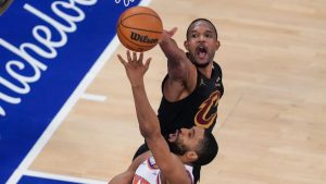 New York Knicks guard Mikal Bridges (25) shoots against Cleveland Cavaliers center Evan Mobley (4) during the second half of Game 1 in the Eastern Conference finals NBA playoffs series Tuesday, May 19, 2026, in New York. (Yuki Iwamura/AP)