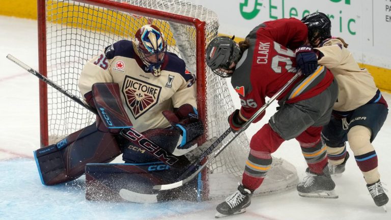 Ottawa Charge forward Emily Clark
tried to put the puck past Montreal Victoire goalie Ann-Renee Desbiens under pressure from defence Amanda Boulier
during first period game 3 PWHL Walter Cup playoff hockey action in Ottawa, Monday May 18, 2026. (Adrian Wyld/CP)