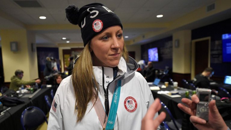 Meghan Duggan, of the gold medal winning U.S. women's Olympic hockey team, listens to a question from the media before an outdoor NHL hockey game between the Washington Capitals and the Toronto Maple Leafs, Saturday, March 3, 2018, in Annapolis, Md. (Nick Wass/AP)