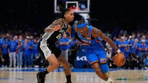 Oklahoma City Thunder guard Shai Gilgeous-Alexander, right, works against San Antonio Spurs guard Devin Vassell during Game 1 of the Western Conference finals of the NBA playoffs Monday, May 18, 2026, in Oklahoma City. (Tony Gutierrez/AP)