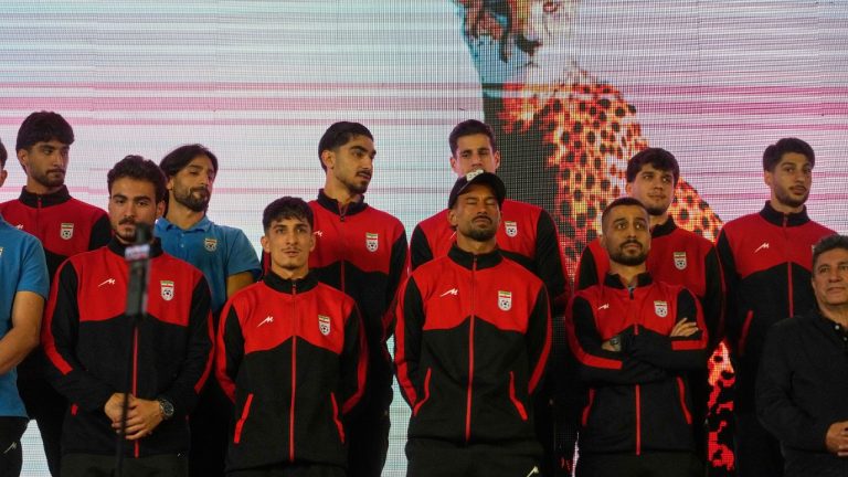 Iran's national soccer team players stand onstage as they are greeted by a crowd during a pro-government gathering before their departure for training and friendly matches in Turkey ahead of the World Cup at Islamic Revolution Square in Tehran, Iran, Wednesday, May 13, 2026. (AP Photo/Vahid Salemi)