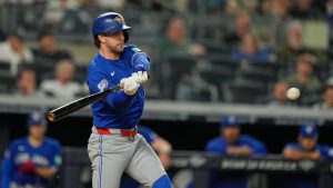 Toronto Blue Jays' Ernie Clement hits into a fielders choice and scores a run during the sixth inning of a baseball game against the New York Yankees, Monday, May 18, 2026, in New York. (Seth Wenig/AP)