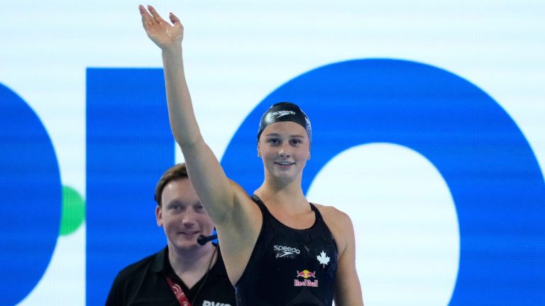 Summer McIntosh of Canada celebrates after winning gold medal in the women's 400-meter individual medley final at the World Aquatics Championships in Singapore, Sunday, Aug. 3, 2025. (Vincent Thian/AP)