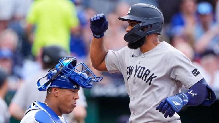 New York Yankees' Amed Rosario runs past Kansas City Royals catcher Salvador Perez after hitting a two-run home run during the first inning of baseball game Tuesday, May 26, 2026, in Kansas City, Mo. (Charlie Riedel/AP)