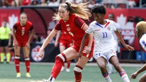 Canada's Jordyn Huitema makes the pass against Haiti Roseline Éloissant during second half soccer action in Winnipeg, Saturday, May 31, 2025. (John Woods/CP)