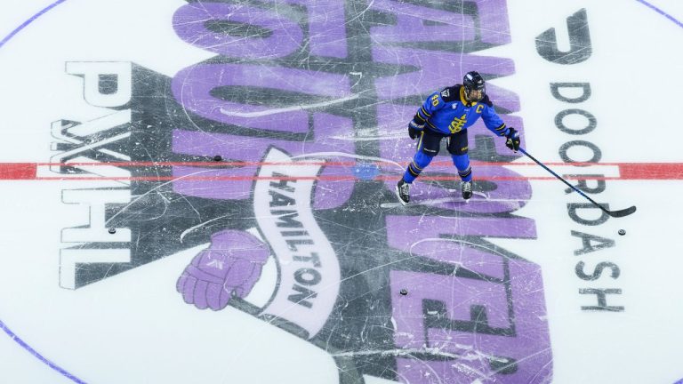 Toronto Sceptres' Blayre Turnbull (40) collects pucks on the PWHL Takeover Tour logo ahead of PWHL action against the Seattle Torrent in Hamilton, Ont., on Saturday, Jan. 3, 2026. (Nick Iwanyshyn/CP)
