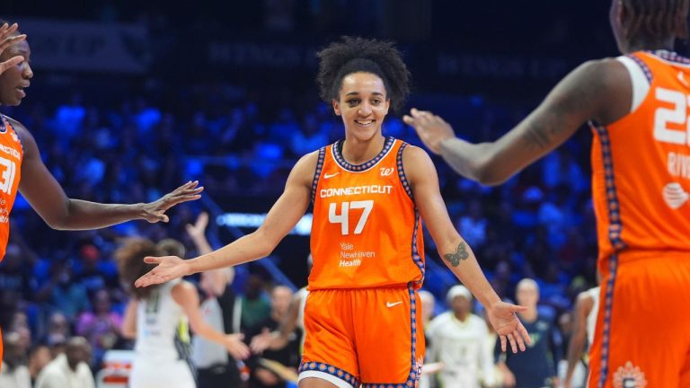 Connecticut Sun guard Leila Lacan celebrates a play with teammates centre Tina Charles and guard Saniya Rivers during the second half of a WNBA basketball game against the Dallas Wings in Arlington, Texas, Wednesday, Aug. 27, 2025. (LM Otero/AP)