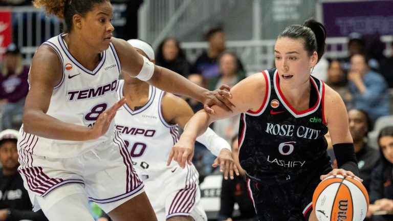 Portland Fire guard Bridget Carleton drives against Toronto Tempo forward Nyara Sabally during first half WNBA basketball action in Toronto, on Saturday May 23, 2026. (Frank Gunn/CP)