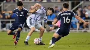 San Jose Earthquakes forward Preston Judd, middle, tries to control the ball between Vancouver Whitecaps defender Mathias Laborda, left, and midfielder Sebastian Berhalter (16) during the first half of an MLS match Saturday, May 9, 2026, in San Jose, Calif. (AP/Jeff Chiu)