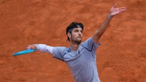 Italy's Lorenzo Musetti serves the ball to Norway's Casper Ruud during their match at the Italian Open tournament in Rome, Tuesday, May 12, 2026. (Alessandra Tarantino/AP)