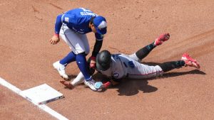 Miami Marlins' Heriberto Hernández (13) is caught trying to steal third by Toronto Blue Jays third baseman Kazuma Okamoto (7) during sixth inning MLB baseball action in Toronto on Wednesday, May 27, 2026. (Chris Young/CP)
